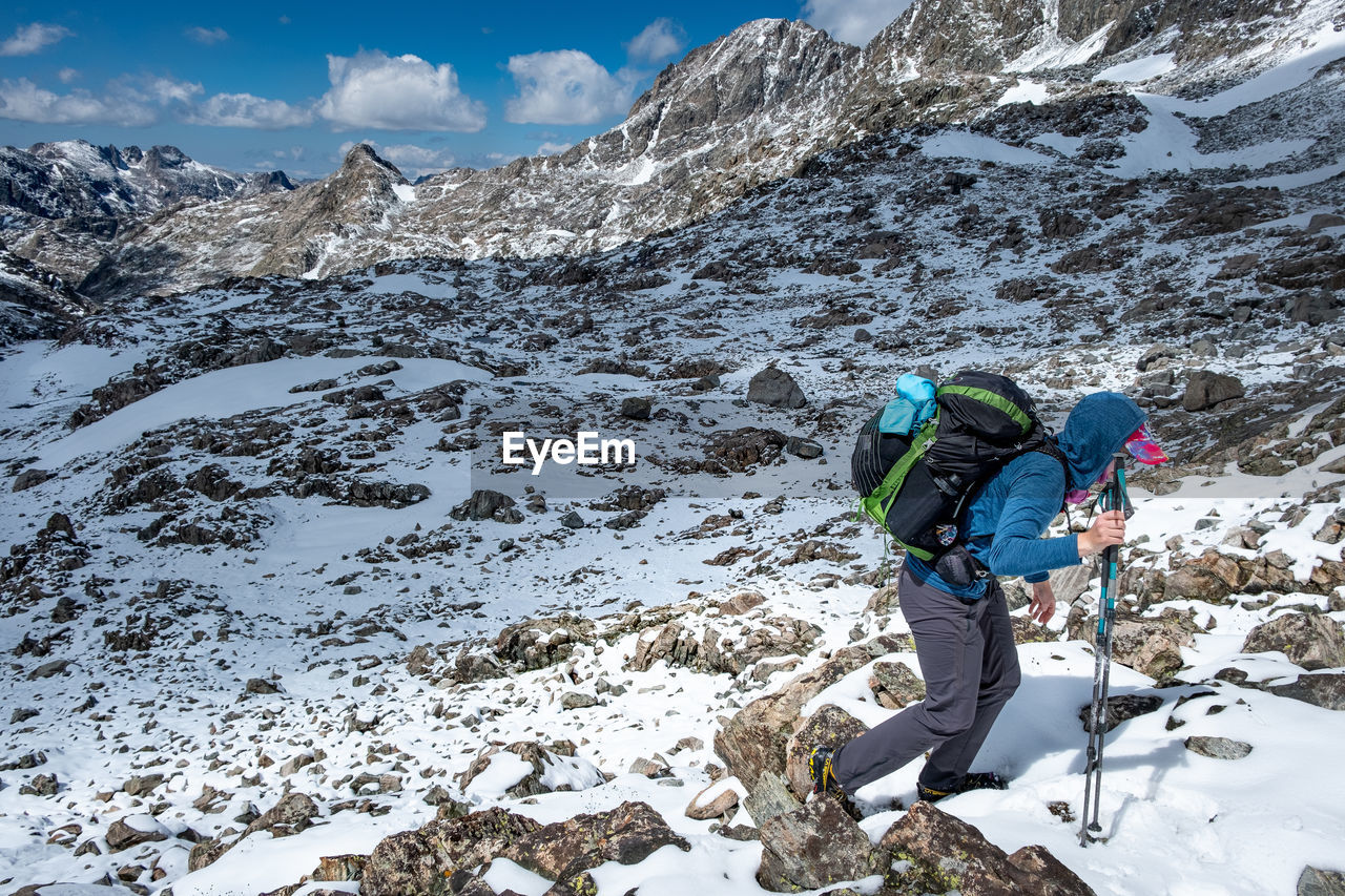 Woman skiing on snowcapped mountain