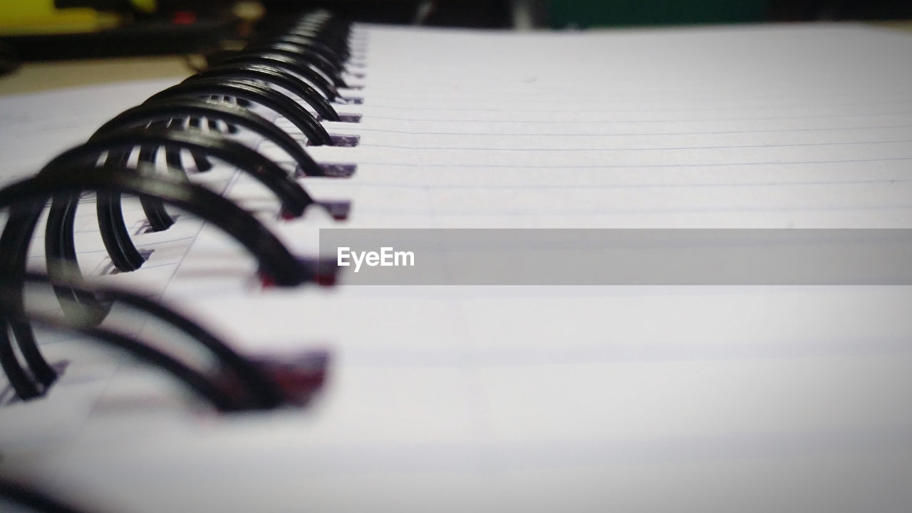 white, close-up, black, selective focus, indoors, no people, piano, arts culture and entertainment, music, writing, still life, paper, musical equipment, musical instrument, piano key, in a row