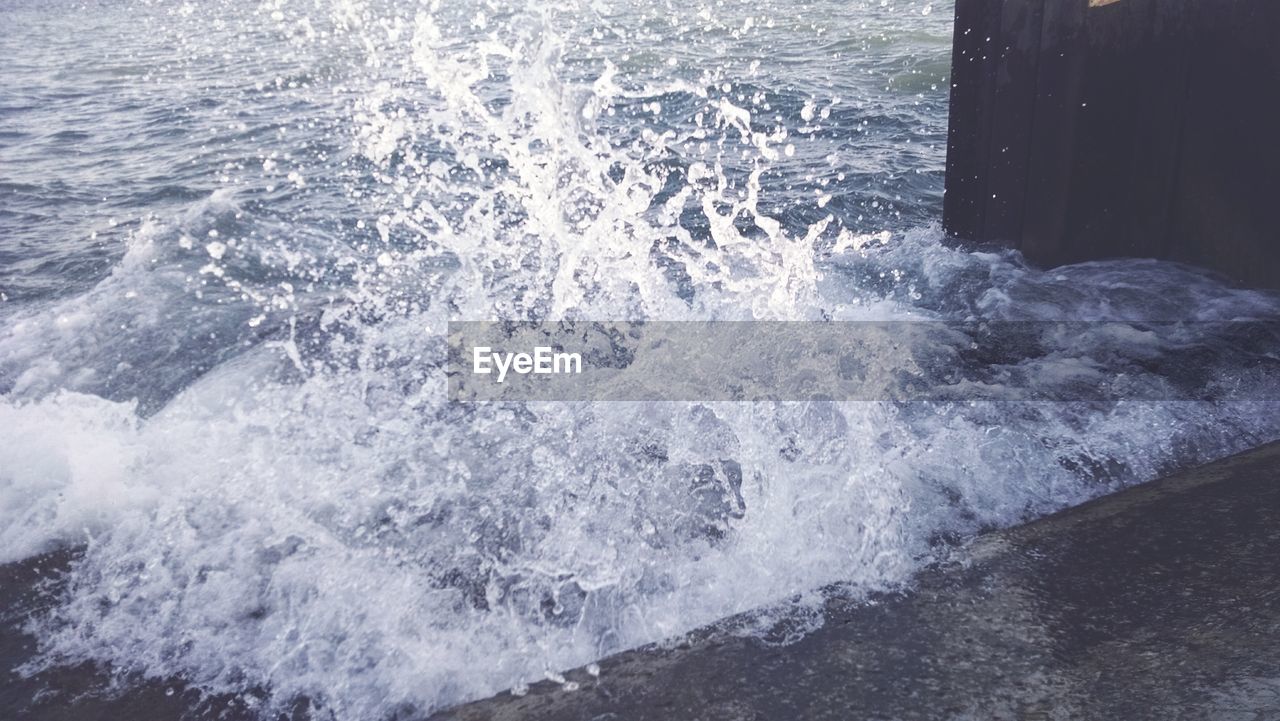 High angle view of water splashing on wall