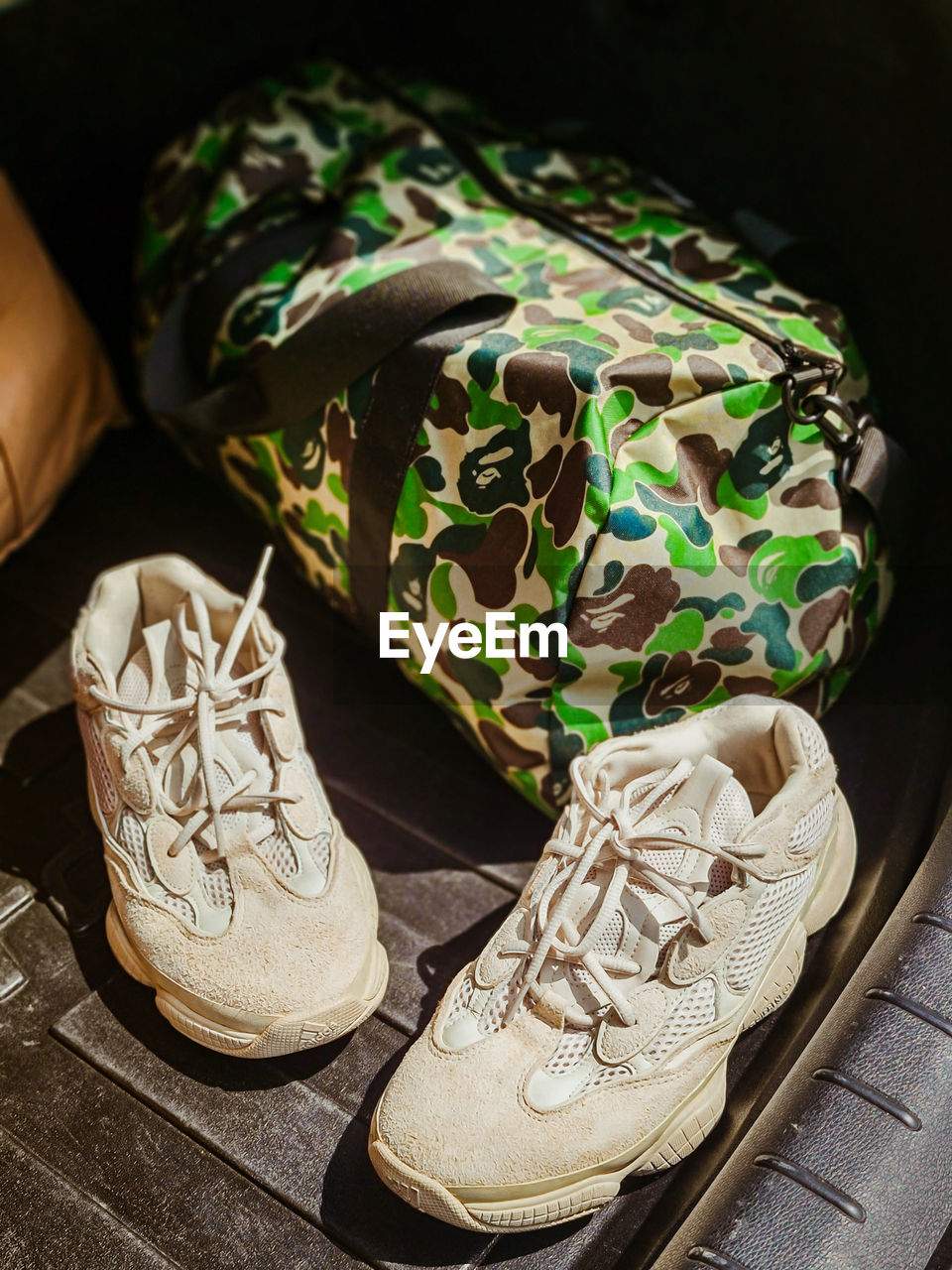 HIGH ANGLE VIEW OF SHOES ON TABLE AT HOME