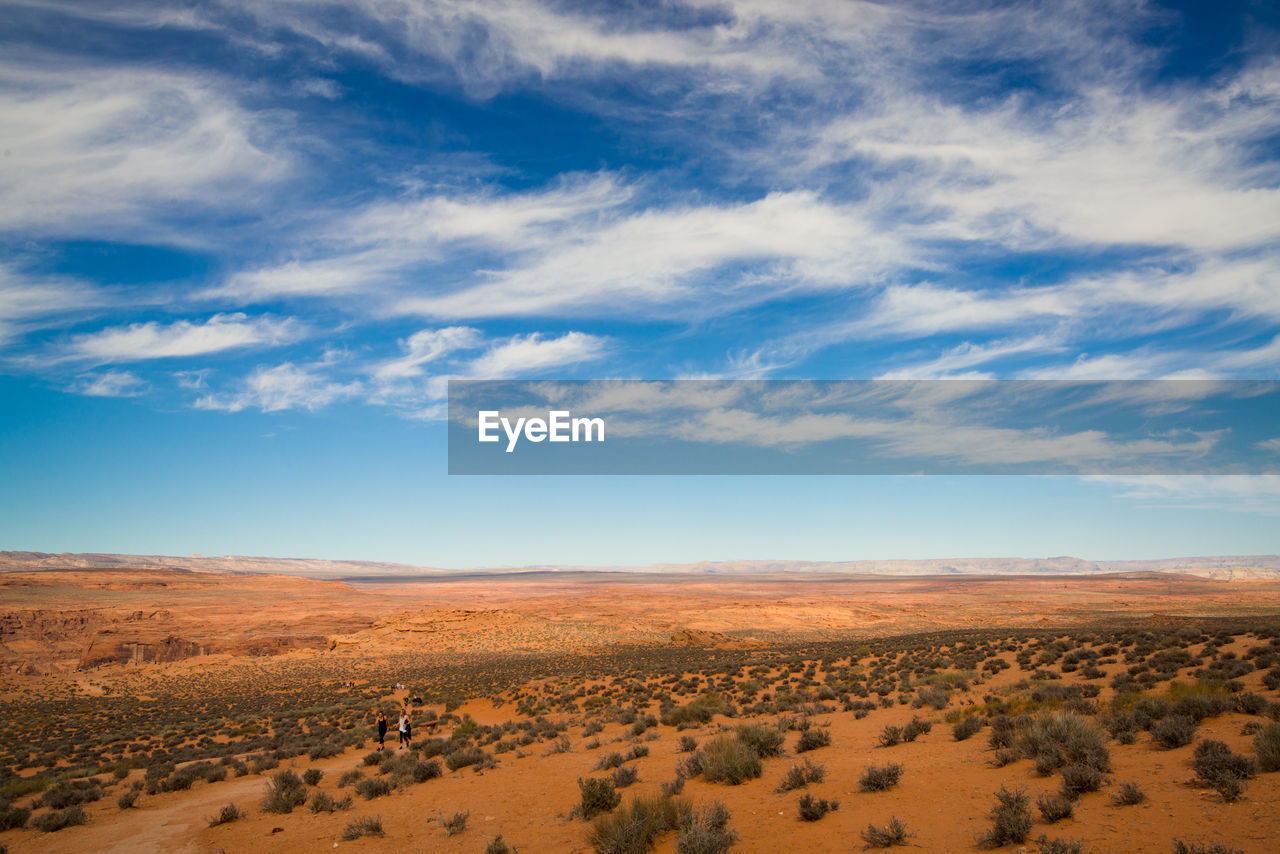 Scenic view of arid landscape against sky