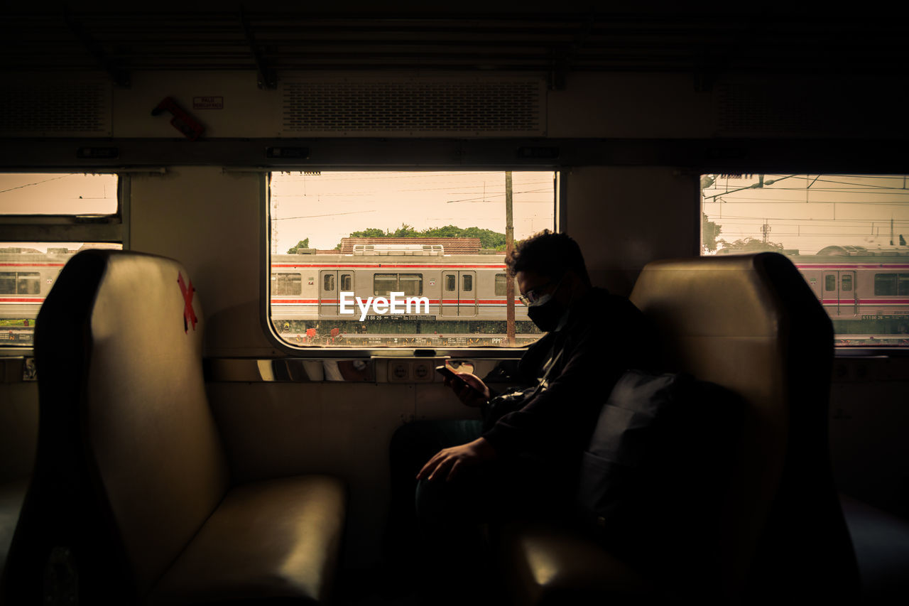 Man sitting in train