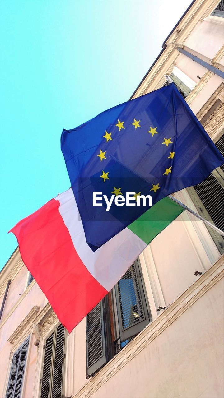 LOW ANGLE VIEW OF FLAG AGAINST SKY