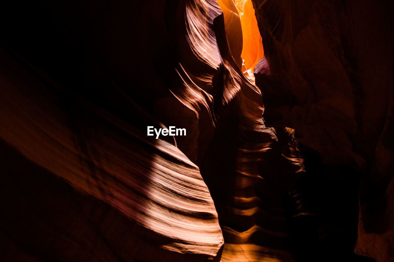LOW ANGLE VIEW OF STATUE WITH ROCK FORMATION