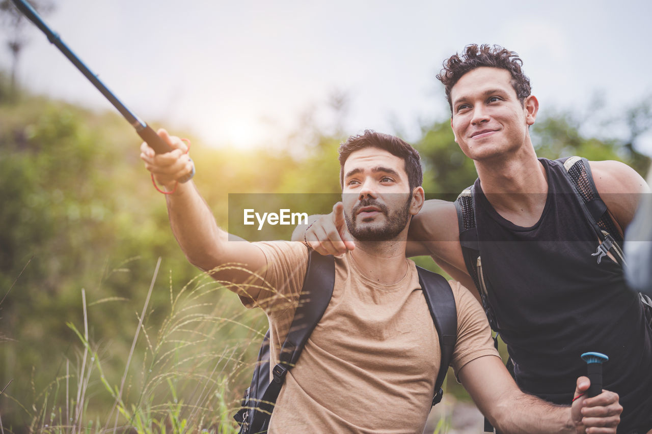 Friends taking selfie in forest