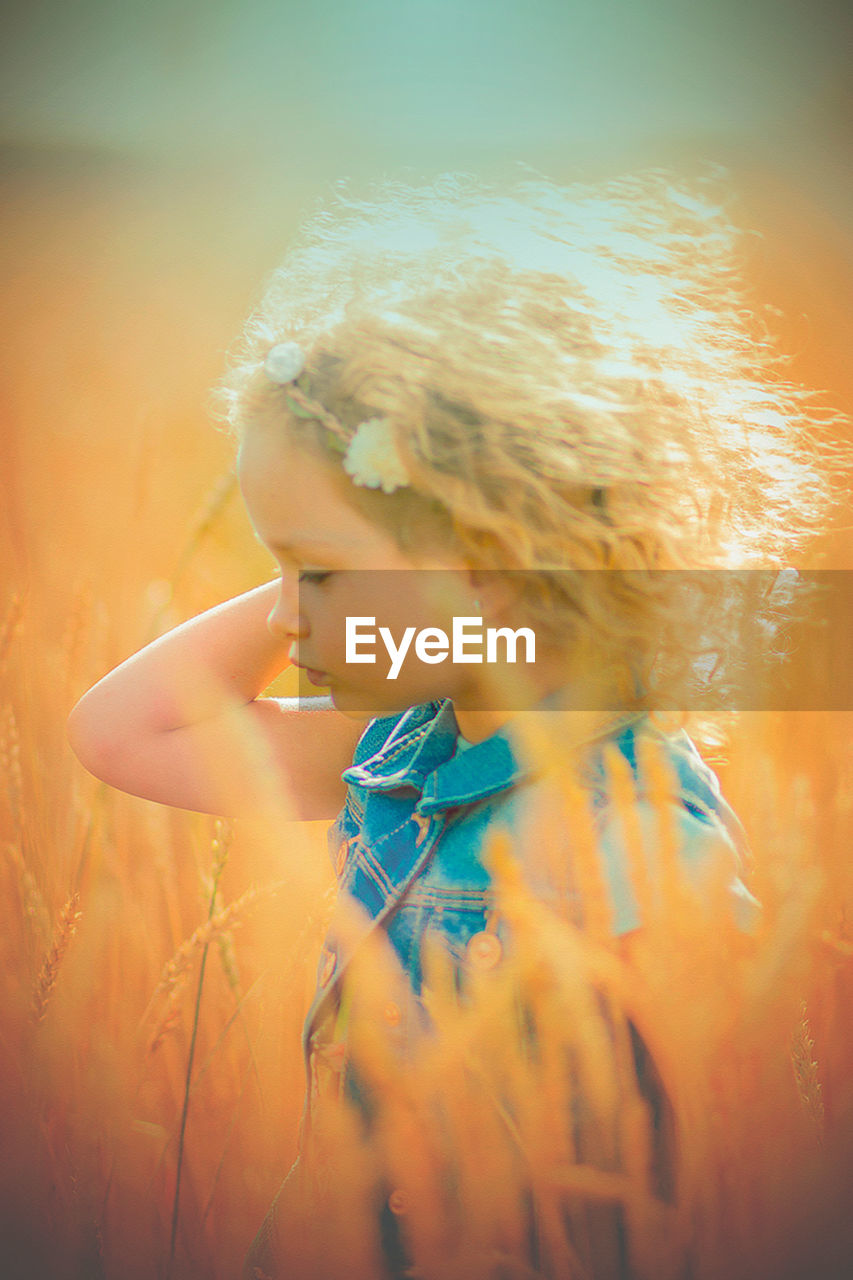 Close-up of girl standing in farm