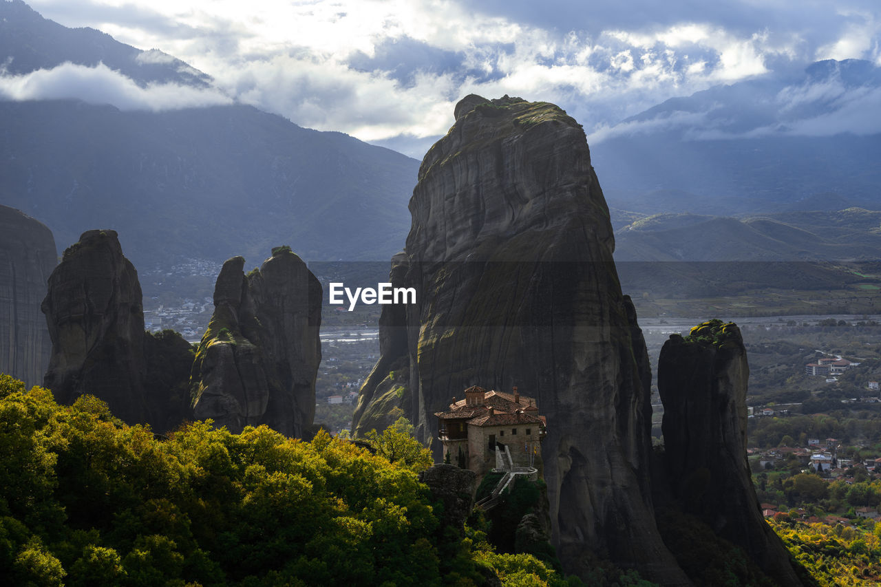 Scenic view of mountain against cloudy sky