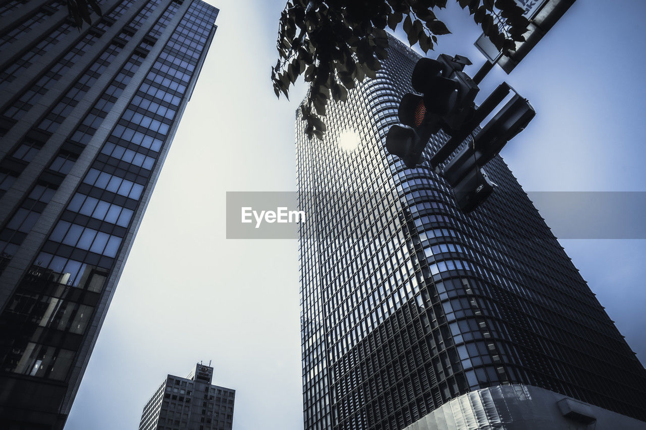 low angle view of skyscrapers against clear sky