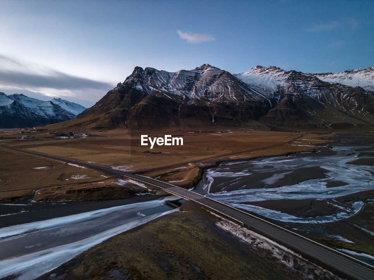 Aerial scenic view in southeast iceland, view on a mountain, river and bridge