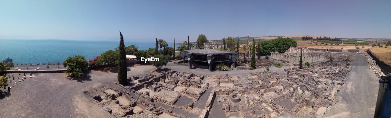 PANORAMIC SHOT OF CONSTRUCTION SITE AGAINST SKY