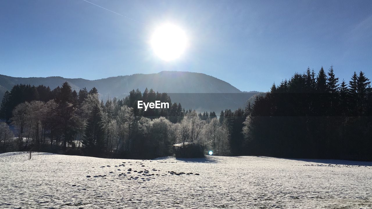 Scenic view of snowcapped mountains against sky during winter