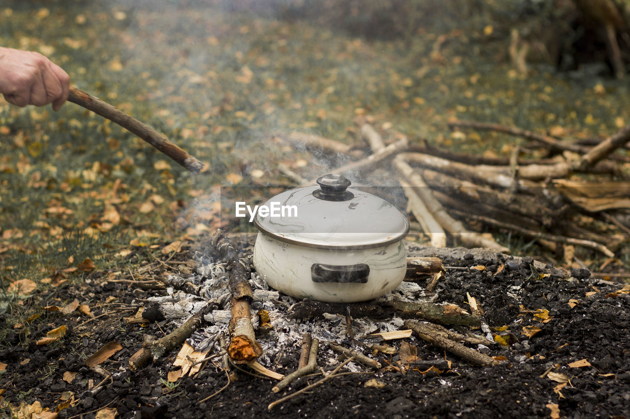 Cooking in a pot outdoor, campfire