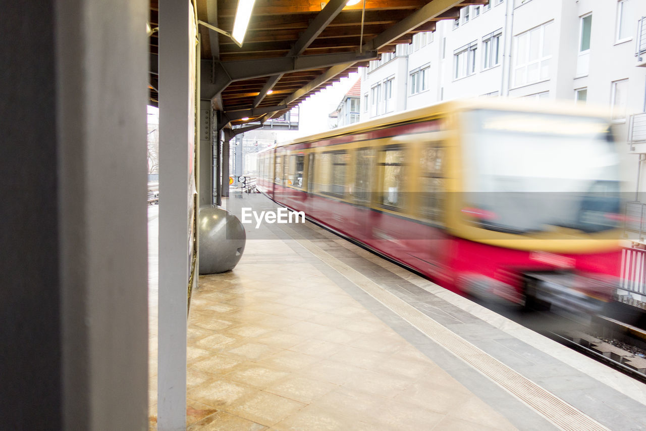 Blurred motion of train arriving at station
