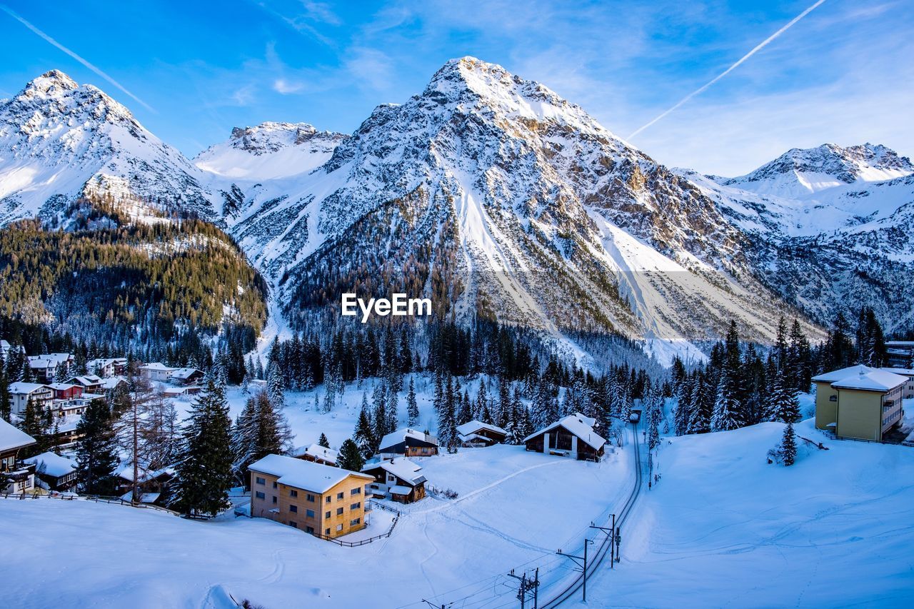 Snow covered field against sky