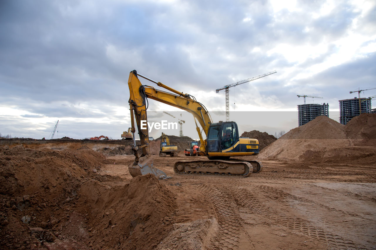 Excavator during earthmoving at construction site. backhoe dig ground for the construction 