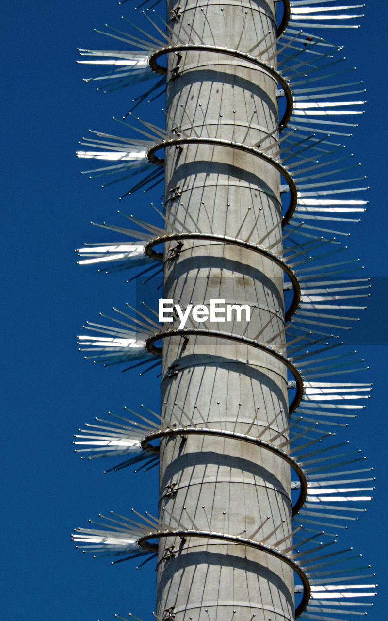 Close-up of elevated spiral structure against the sky