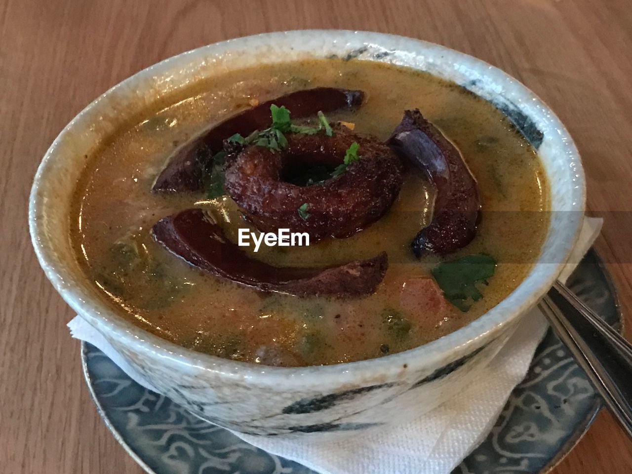 High angle view of cheese soup in bowl on table