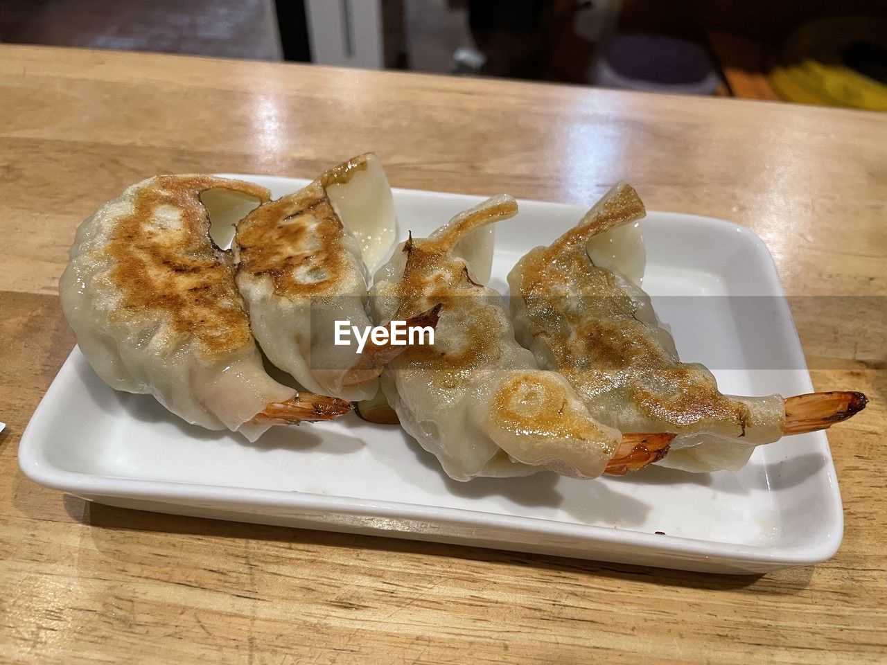 food and drink, food, freshness, table, dish, indoors, plate, meal, no people, cuisine, asian food, close-up, healthy eating, still life, mandu, serving size, fast food, seafood, chinese food, wellbeing, breakfast, wood, dumpling, high angle view, wonton