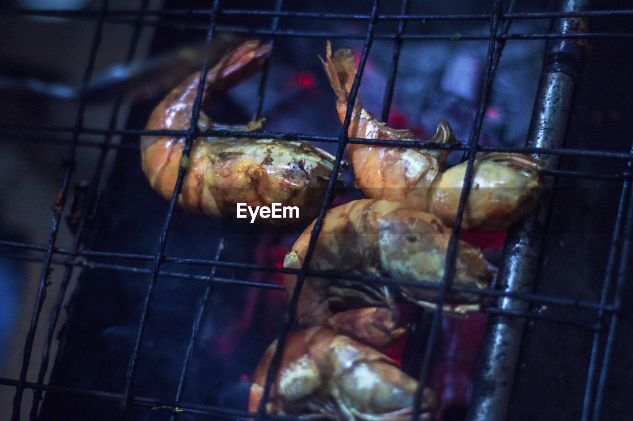 Close-up of shrimps on barbecue grill