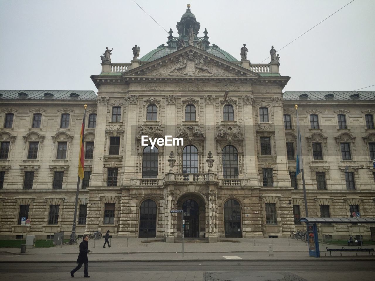 Facade of justizpalast against clear sky