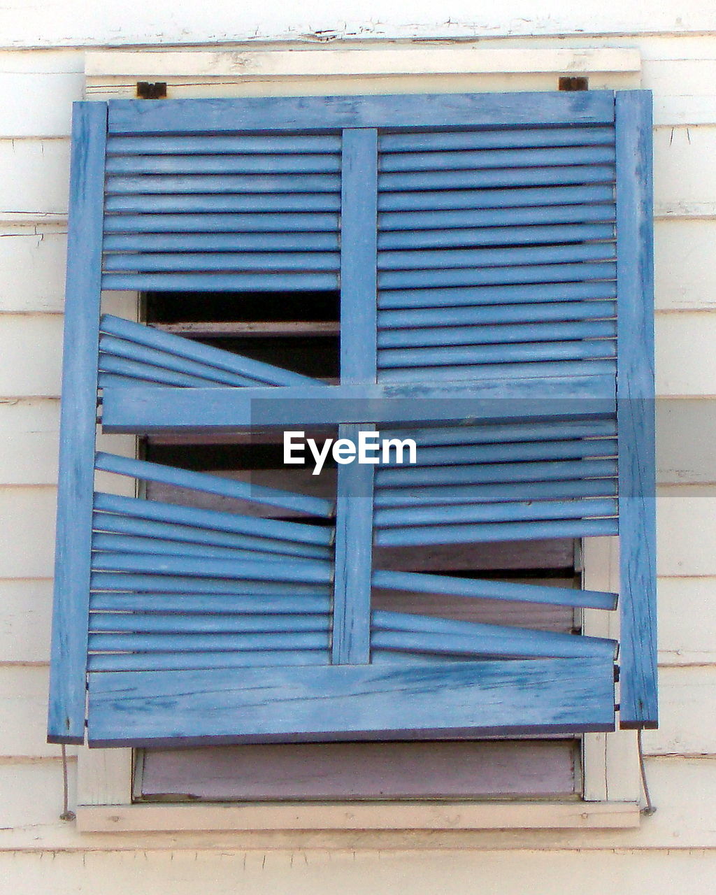 CLOSE-UP OF SHUTTER OF BUILDING WITH CLOSED SHUTTERS