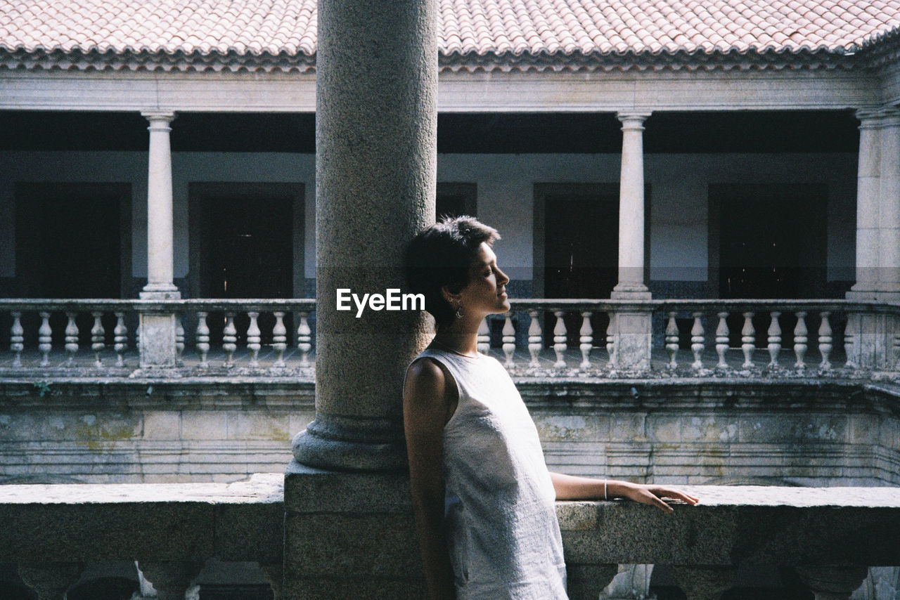 Girl contemplating the cloisters of the convent on viseu