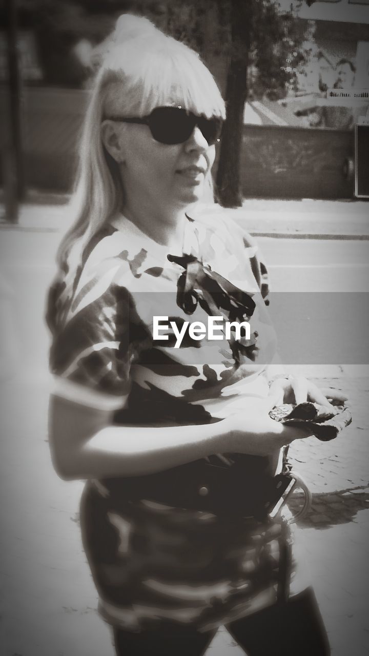 GIRL LOOKING OUT OF WOMAN SITTING