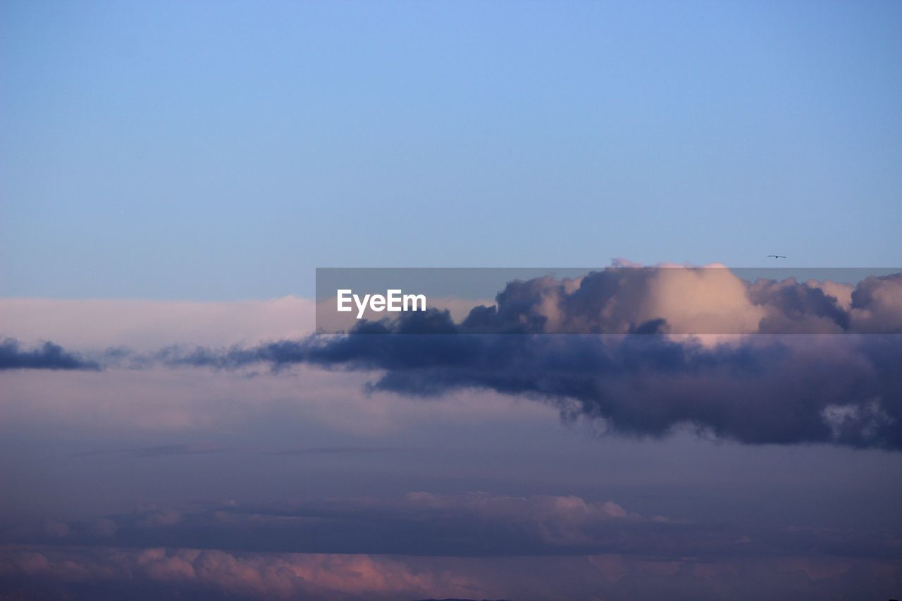 Scenic view of clouds in sky at sunset
