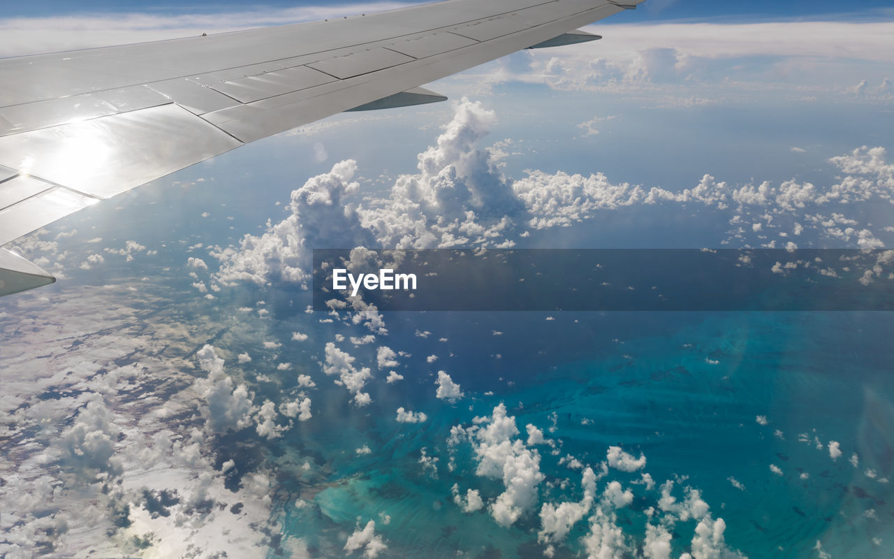 AERIAL VIEW OF SEA AND AIRPLANE WING