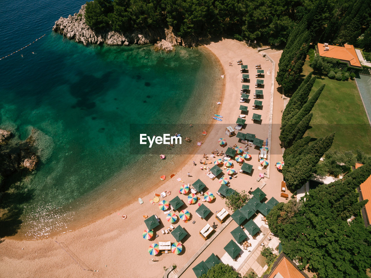 HIGH ANGLE VIEW OF BEACH BY TREES