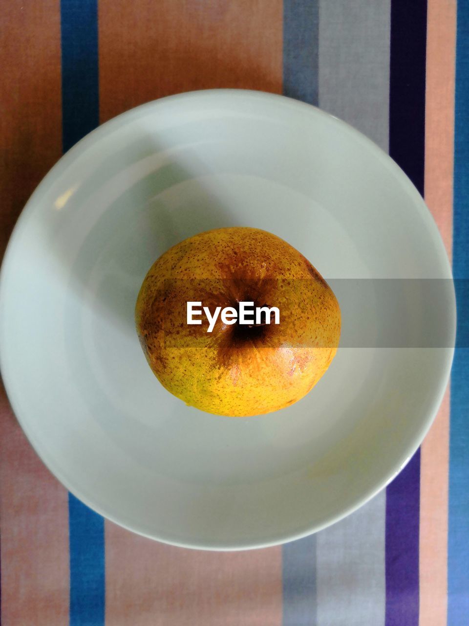 High angle view of fruits in plate on table