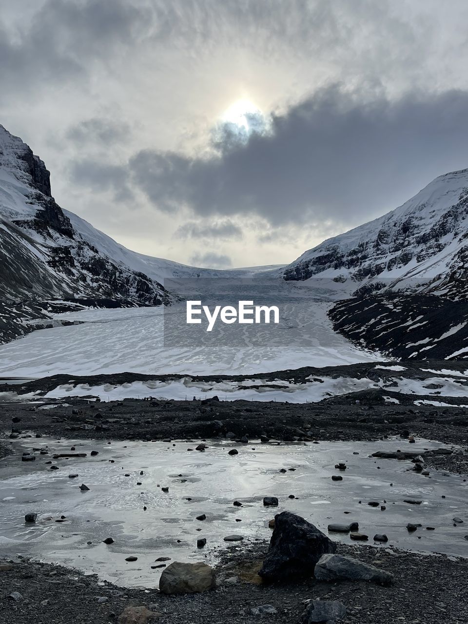 SCENIC VIEW OF SNOWCAPPED MOUNTAIN AGAINST SKY DURING WINTER