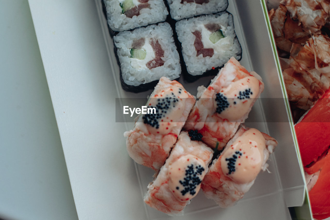 food and drink, food, freshness, cuisine, sushi, dish, high angle view, meal, california roll, indoors, japanese cuisine, no people, seafood, still life, japanese food, asian food, healthy eating, rice, wellbeing, variation, sweet food