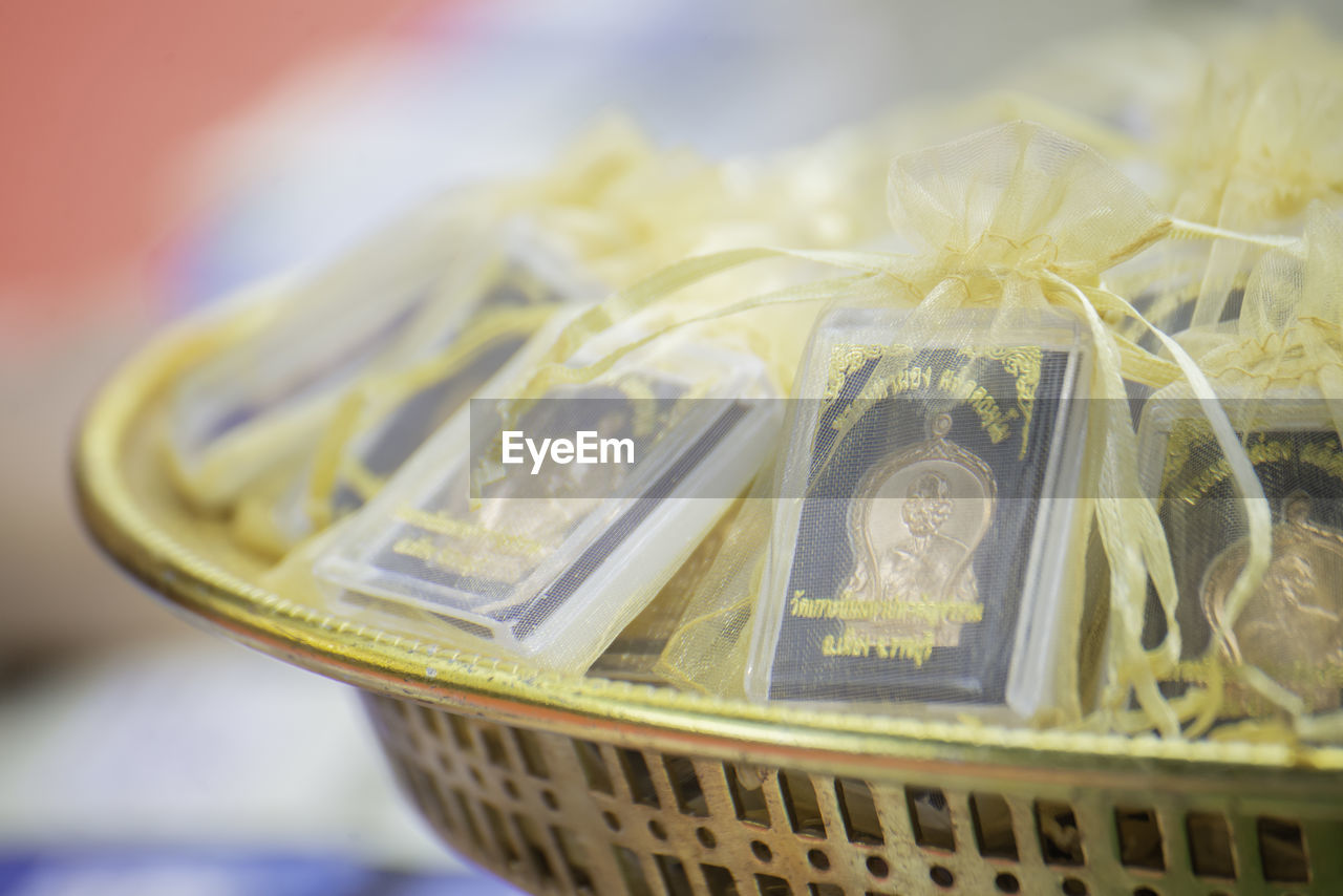 yellow, finance, currency, paper currency, wealth, business, close-up, food, no people, business finance and industry, indoors, container, selective focus, finance and economy