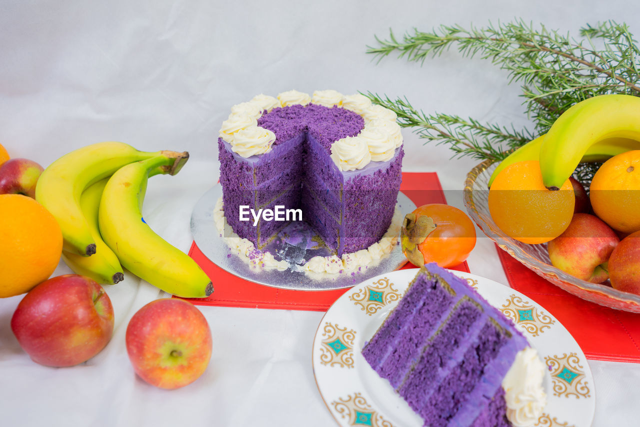 Close-up of cake and fruits on table during christmas