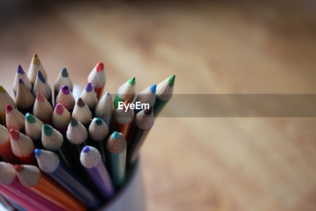 Close-up of colored pencils on table