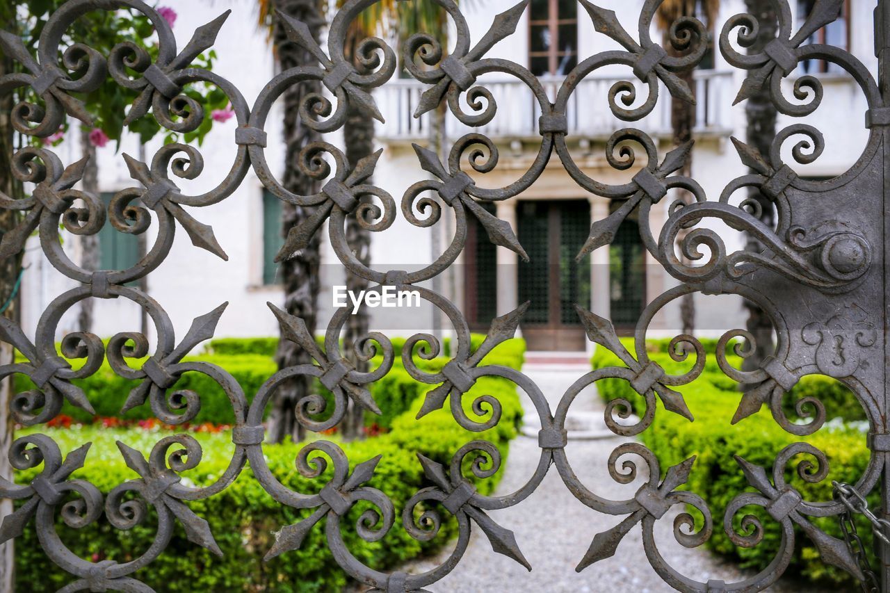 Building seen through from metal gate