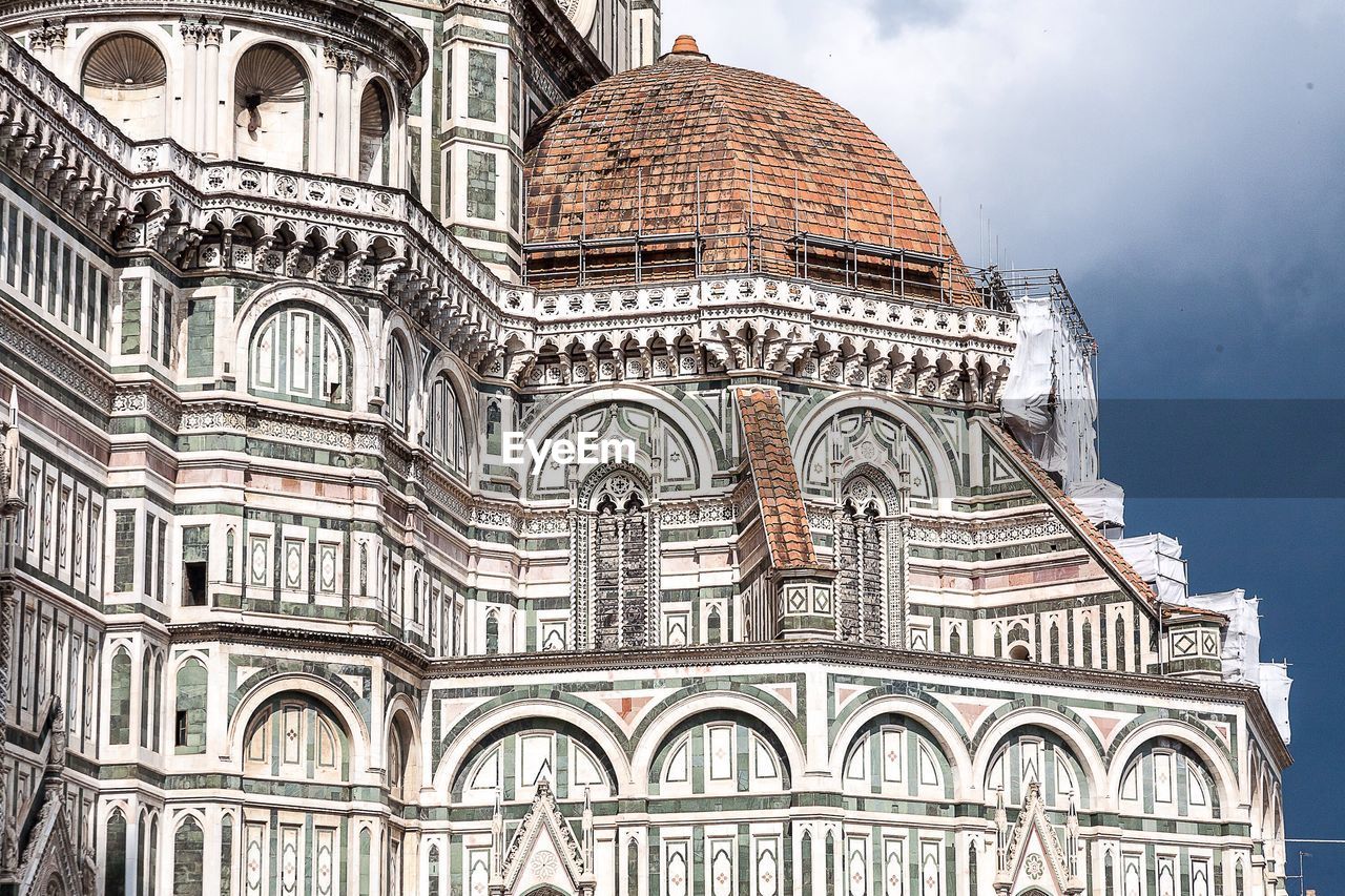 Low angle view of duomo santa maria del fiore against sky in city