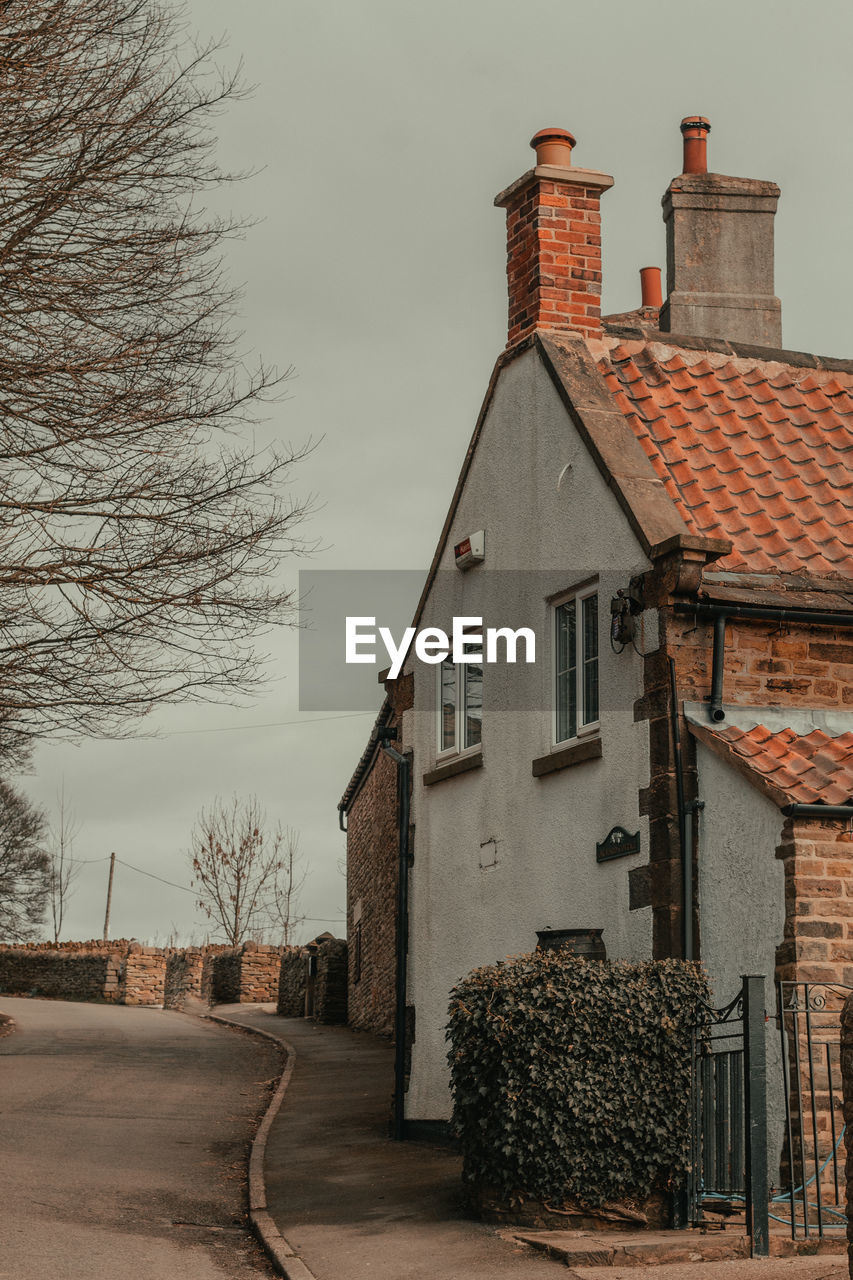 house by building against sky