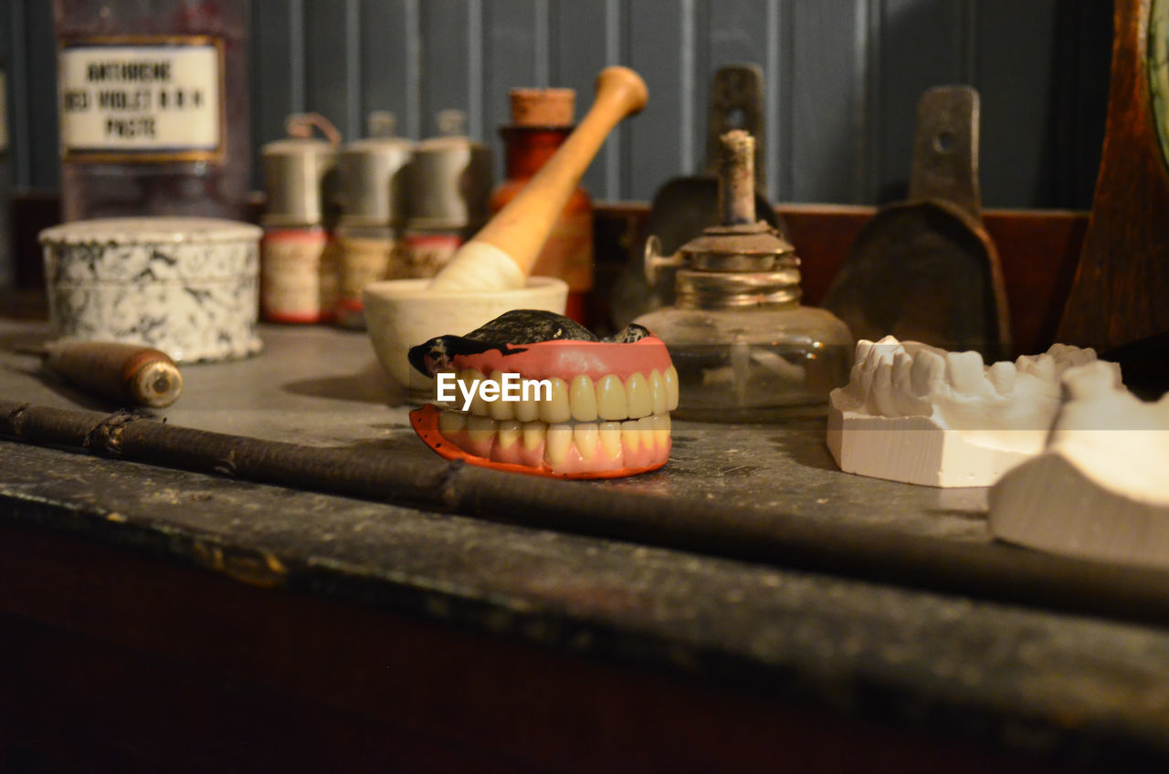 Dentures and objects on table at museum