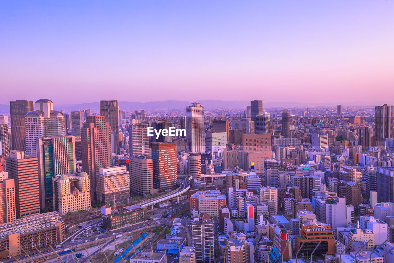 High angle view of buildings against sky during sunset