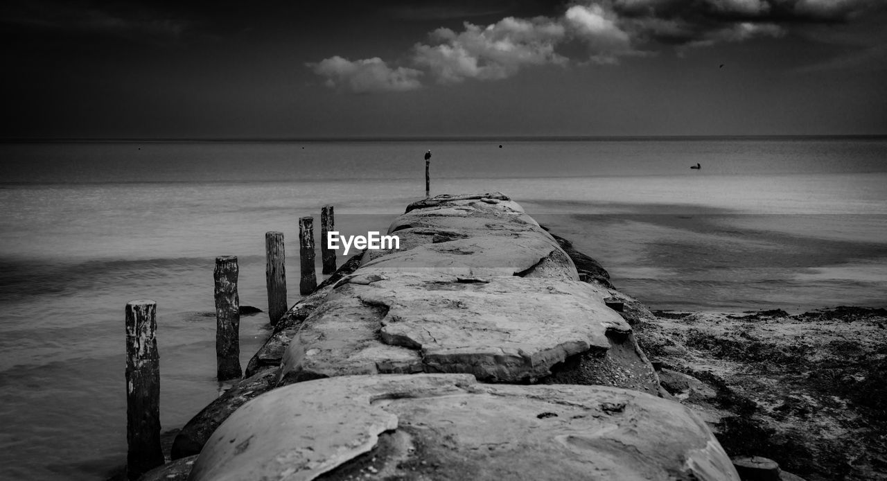 Pier over sea against sky