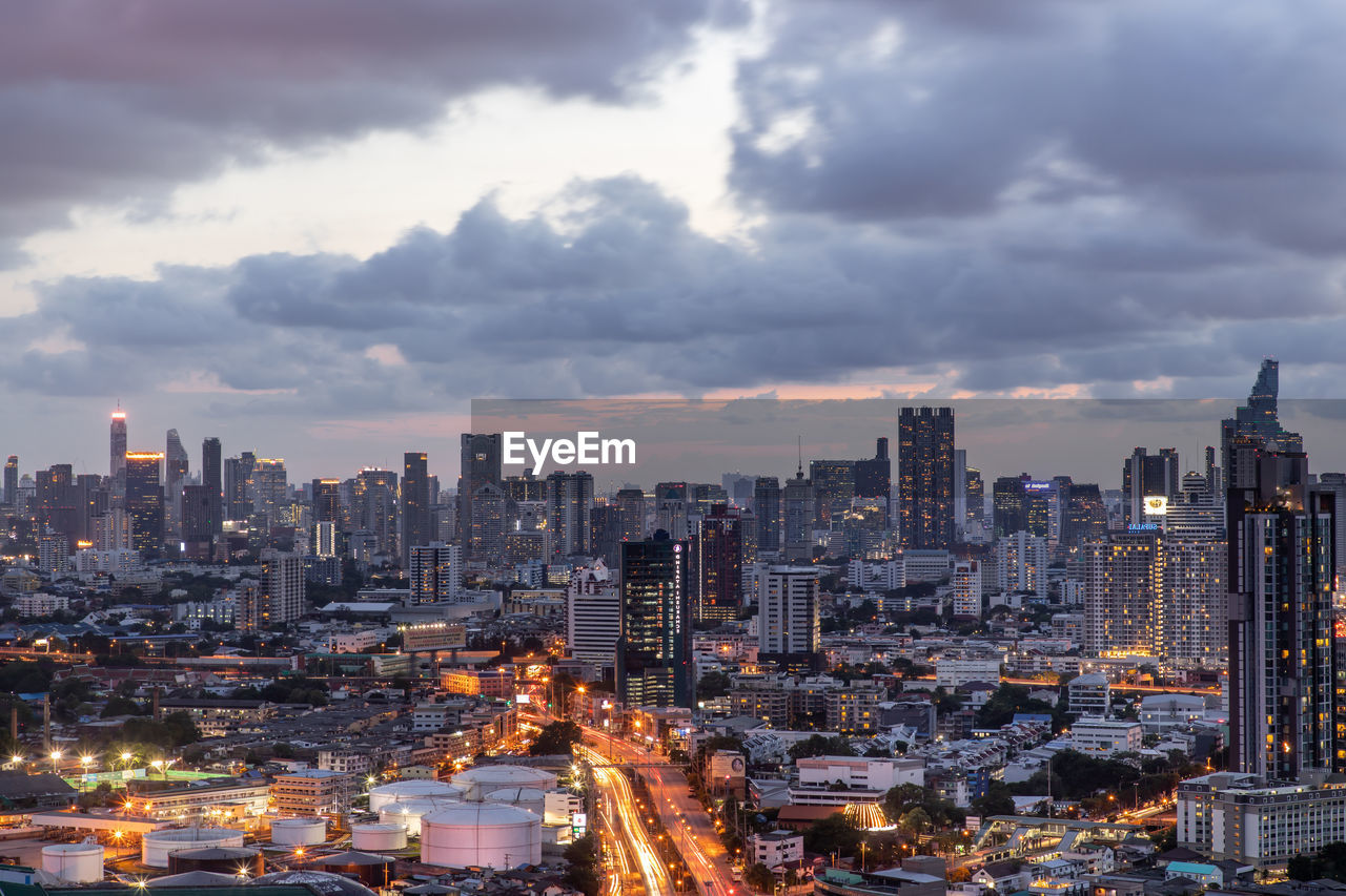 ILLUMINATED CITY AGAINST SKY