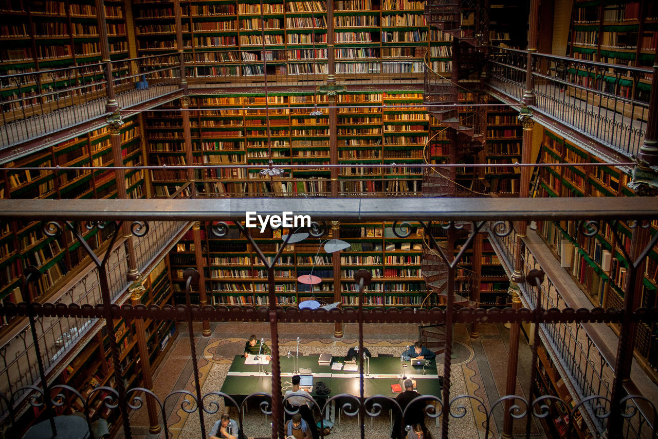 High angle view of people reading books in rijksmuseum research library