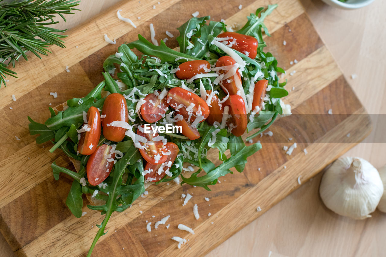 Arugula salad with cherry tomatoes and parmesan cheese