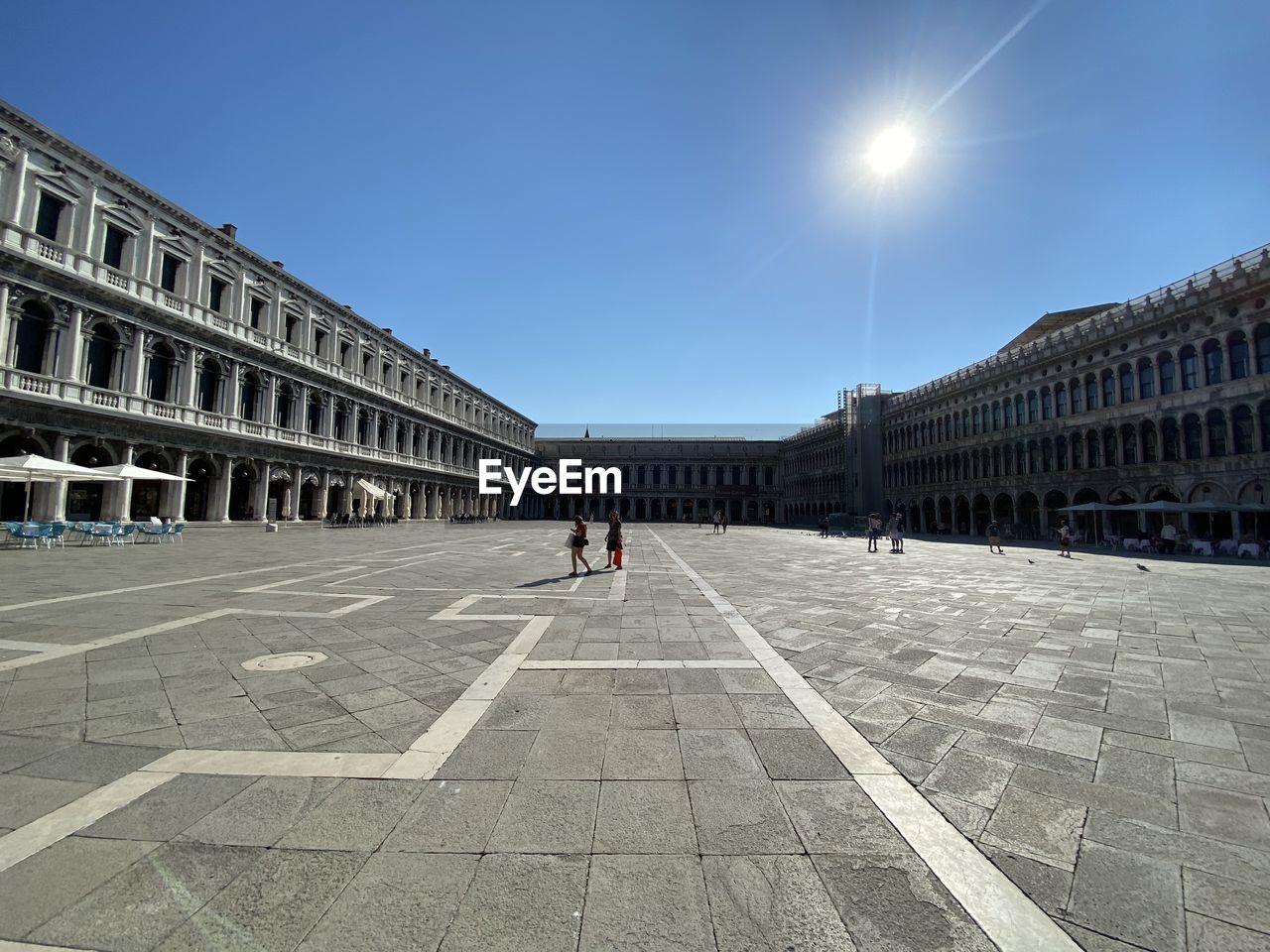 PEOPLE WALKING IN TOWN SQUARE