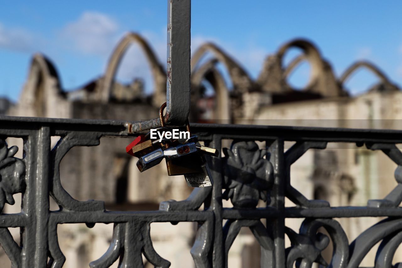 CLOSE-UP OF PADLOCK ON FENCE