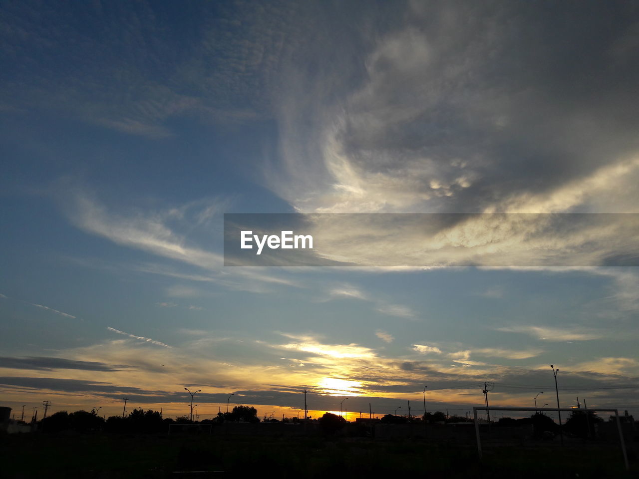 SCENIC VIEW OF SILHOUETTE TREES AGAINST SKY AT SUNSET