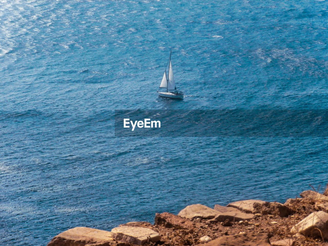 Sailboat sailing by the sea