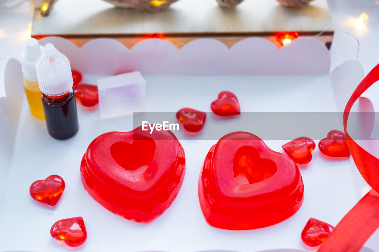red, valentine's day, heart, petal, heart shape, food and drink, love, positive emotion, sweet, sweet food, no people, candle, food, indoors, emotion, dessert, candy, celebration